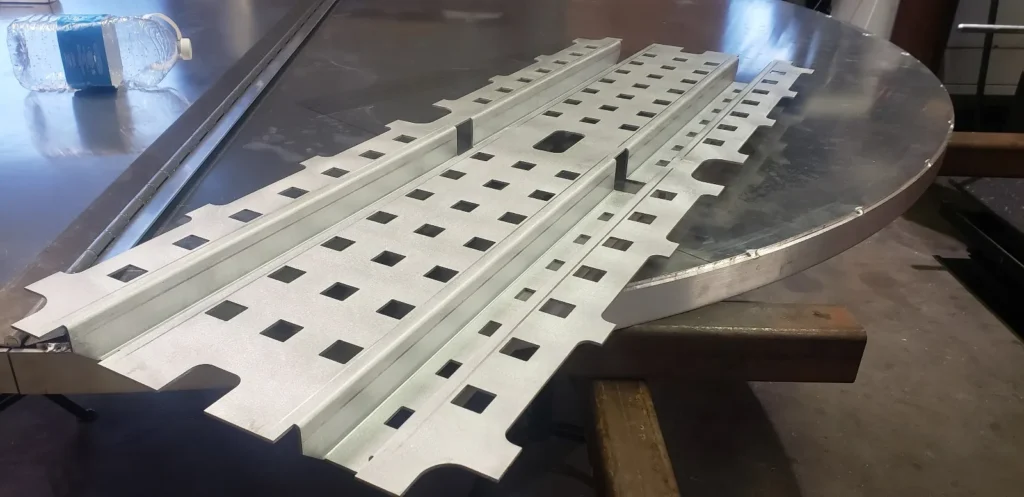Aluminum sheet metal parts fabricated with precision slots