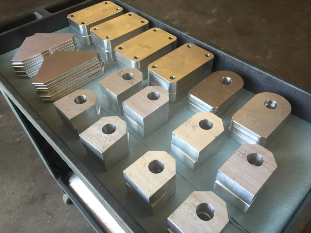 Stack of precision CNC machined aluminum blocks and components
